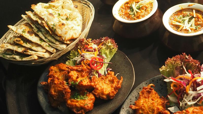 22 Irresistible Dishes That Will Inspire Your Next Homemade Feast 26 Onion Bhaji with Naan and Curry