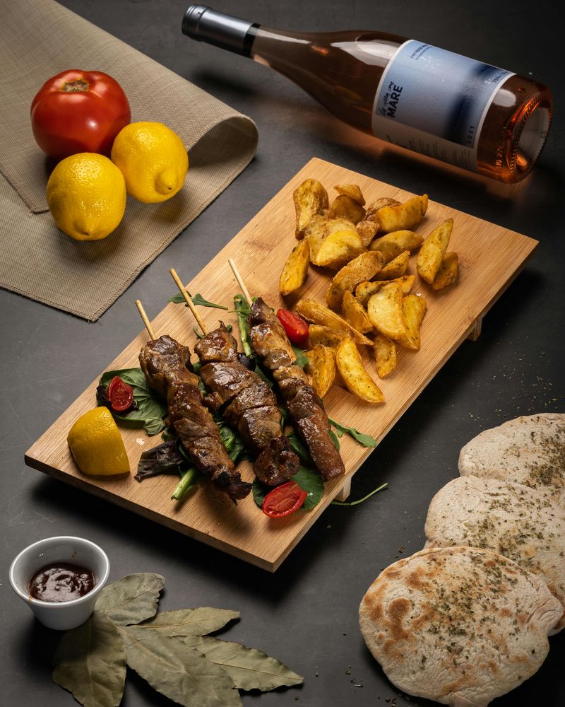 Grilled Lamb Skewers with Potato Wedges & Pita