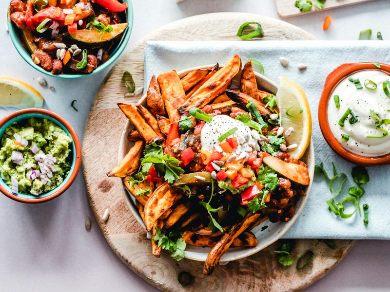 10 Restaurant-Style Dishes You’ll Actually Want to Cook at Home – From Classic Burgers and Caesar Salad to Buddha Bowls, Loaded Fries and Indian Thali 13 Loaded Sweet Potato Fries