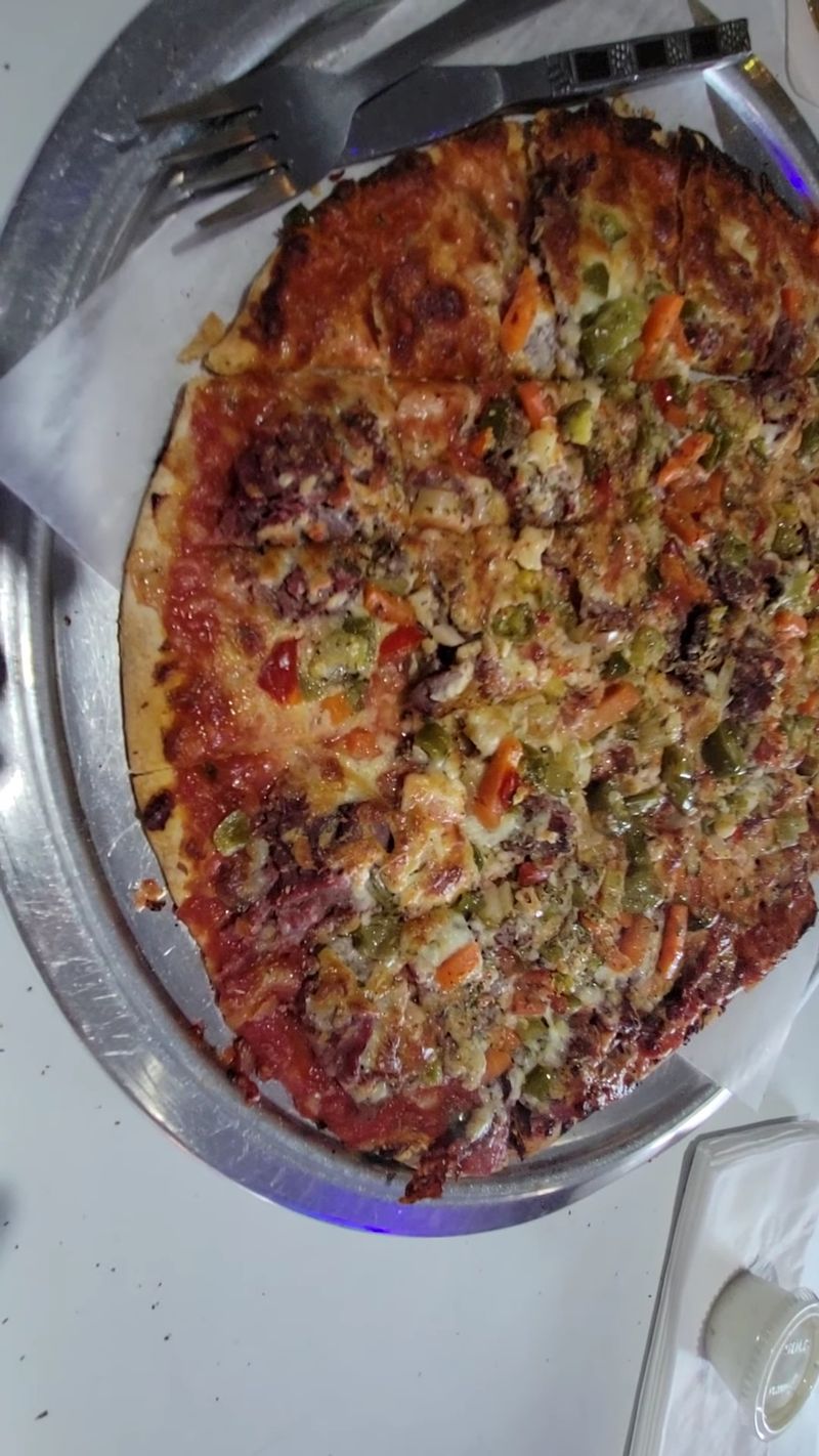 This Chicago Pizza Spot Serves Thin Crust Pizza Locals Say Is The Real Deal 21 Sausage And Giardiniera Heat
