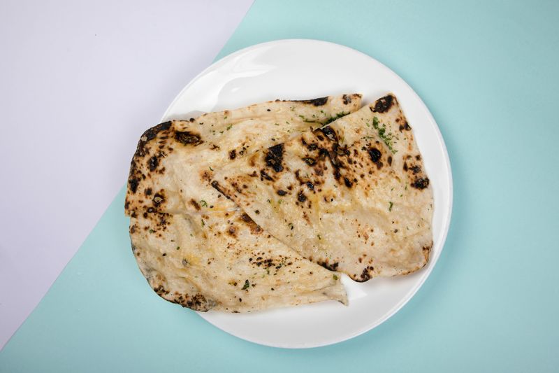 22 Indian Dishes Perfect for People Who Think They Hate Spicy Food 24 Garlic Naan