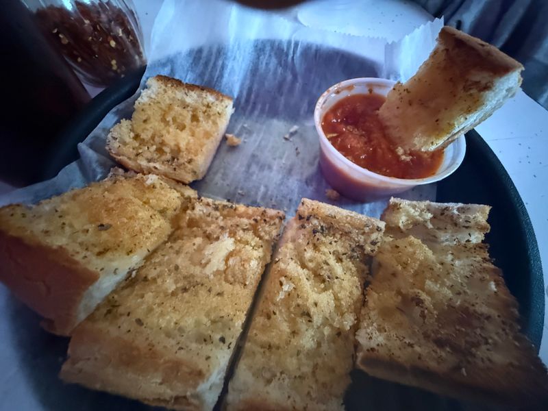 This Chicago Pizza Spot Serves Thin Crust Pizza Locals Say Is The Real Deal 22 Garlic Bread Intermission