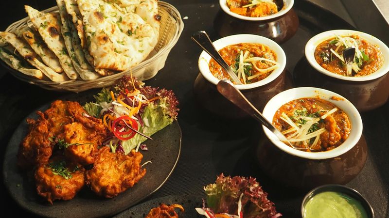 10 Restaurant-Style Dishes You’ll Actually Want to Cook at Home – From Classic Burgers and Caesar Salad to Buddha Bowls, Loaded Fries and Indian Thali 12 Indian Thali – Naan, Curry and Pakora