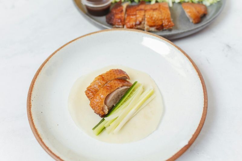 Asian Takeout Obsession: 16 Fiery, Saucy Dishes You’ll Want to Order on Repeat 9 Classic Peking Duck Wrap