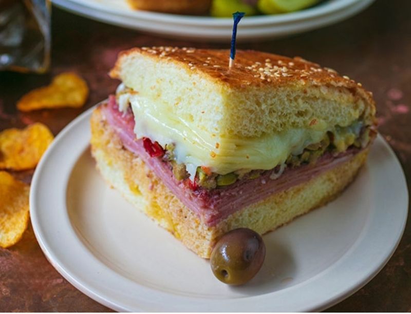 This Louisiana French Quarter Café Serves Warm Muffulettas So Good, Every Bite Feels Like Its Own Little Holiday 7 Olive Salad, The Spark