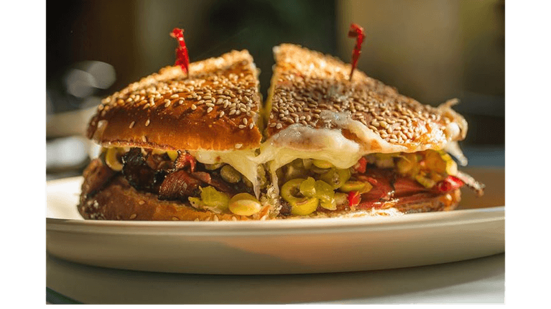 This Louisiana French Quarter Café Serves Warm Muffulettas So Good, Every Bite Feels Like Its Own Little Holiday 6 The Warm Muffuletta Experience
