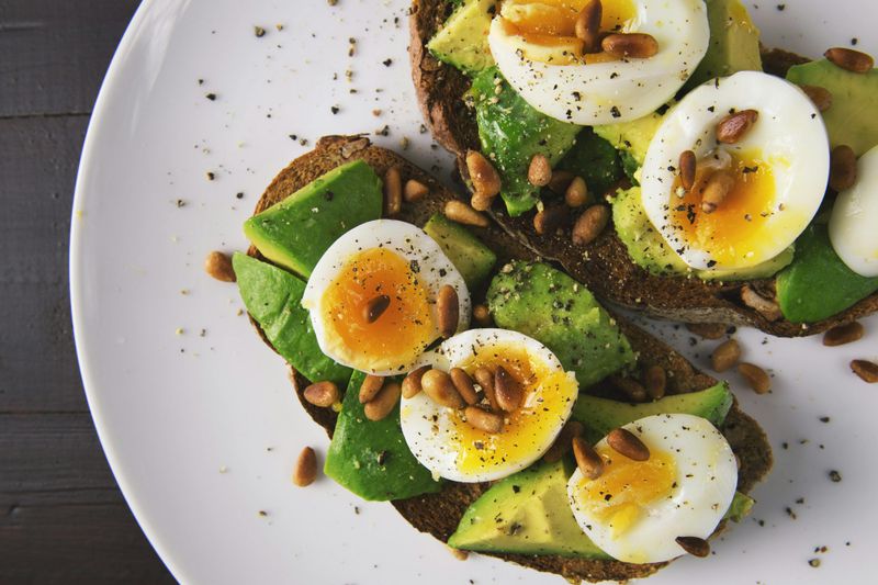 19 Delicious Recipes That Will Instantly Upgrade Your Weekly Menu 10 Avocado Toast with Soft-Boiled Eggs and Pine Nuts