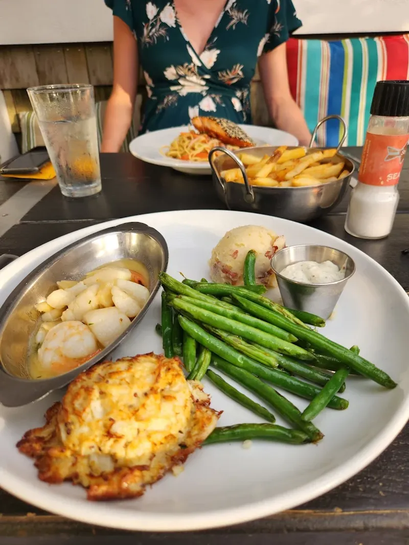 9 Delaware Beachside Seafood Spots Where Crab Fries Disappear First 11 Striper Bites - Lewes, Delaware