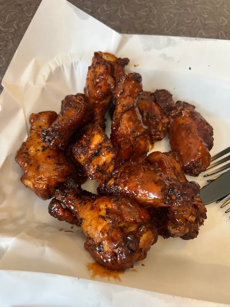 This Missouri BBQ Joint Smokes So Slowly, The Best Plates Disappear First 15 Smoked Chicken Wings with Pepper Vinegar Glaze