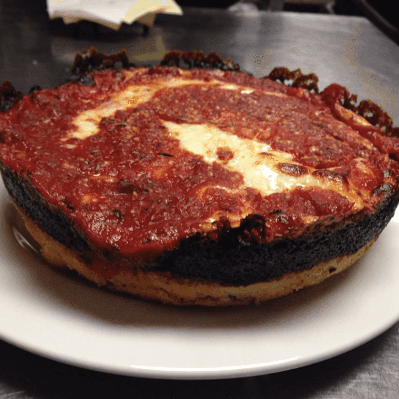 24 Pizza Places Across America Where Thin Crust vs Thick Crust Is the Main Conversation 4 Pequod's Pizza - Chicago, Illinois