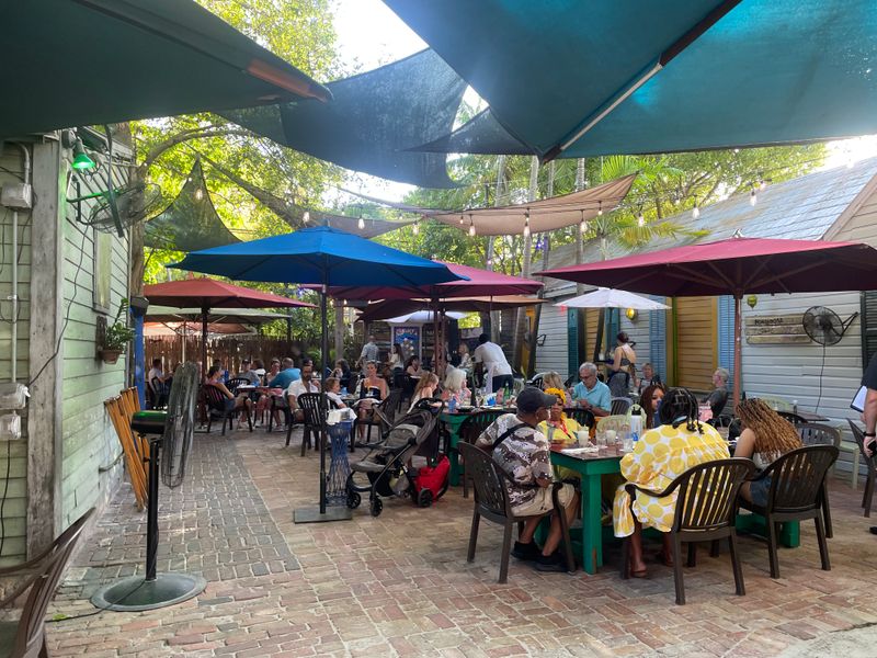 This Funky Florida Restaurant Is Known for a Lobster Benedict Locals Love 3 Courtyard Vibes and Roosters
