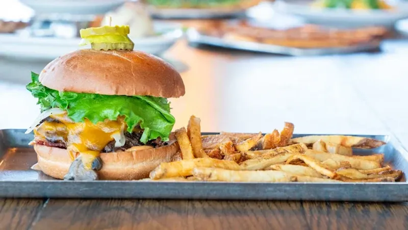 10 Wyoming Mountain Town Cafes Serving Burgers That Hit After A Long Drive 11 Sidewinders American Grill - Jackson, Wyoming