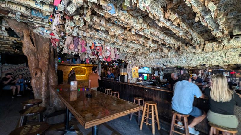 Dollar Bills and Bras Covering the Ceiling