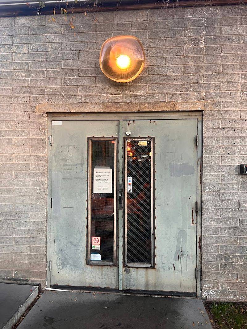 A Hidden Entrance That Sets the Tone