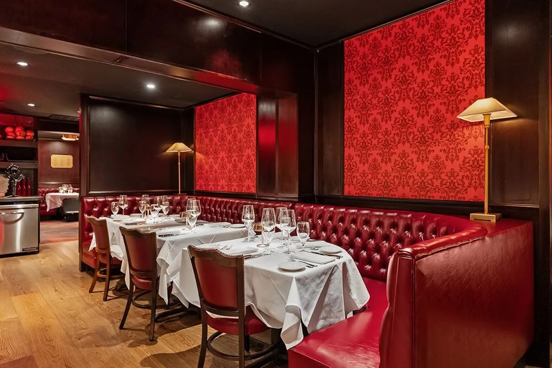 The Iconic Red Leather Booths and Vintage Atmosphere