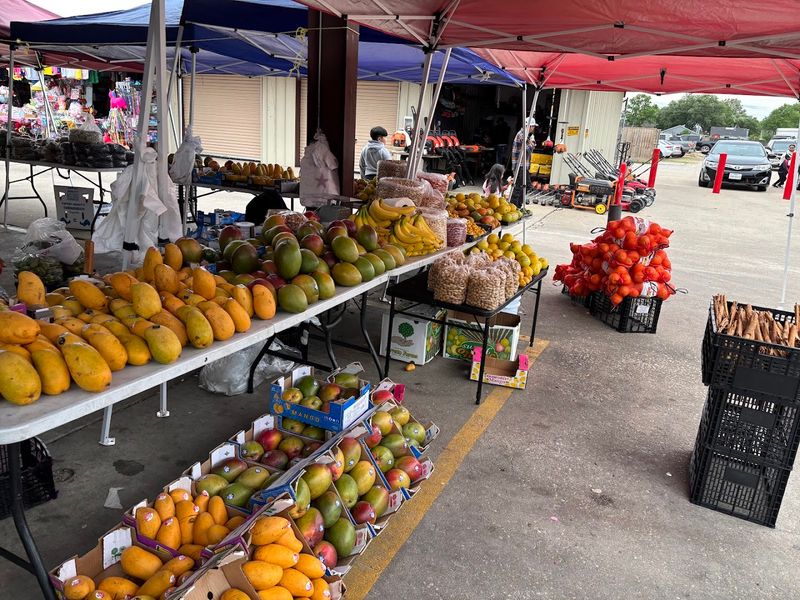 Fresh Produce and Plant Stalls Tucked Among the Vendor Rows