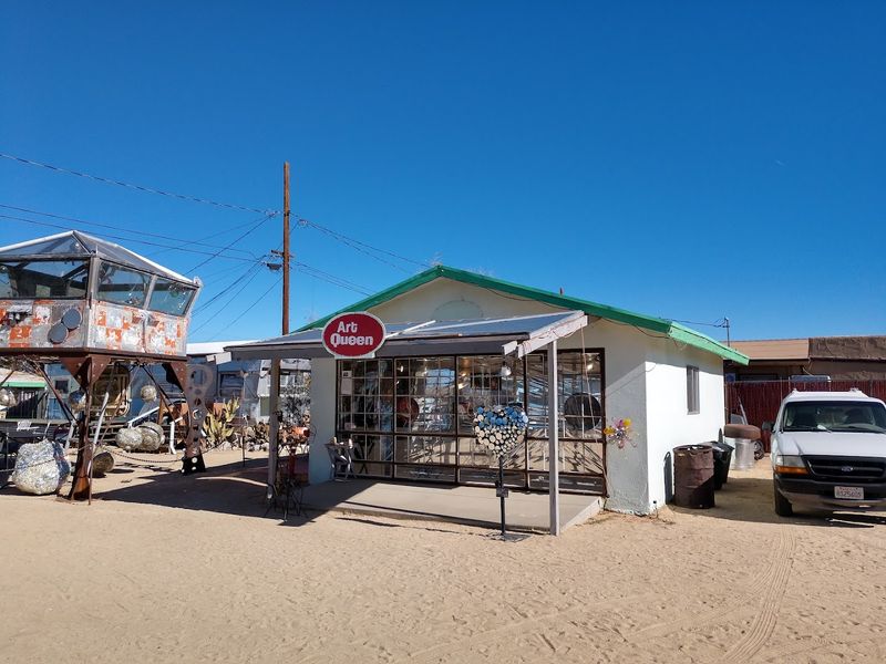 A Colorful Bus and the ART QUEEN Sign Guide Your Way