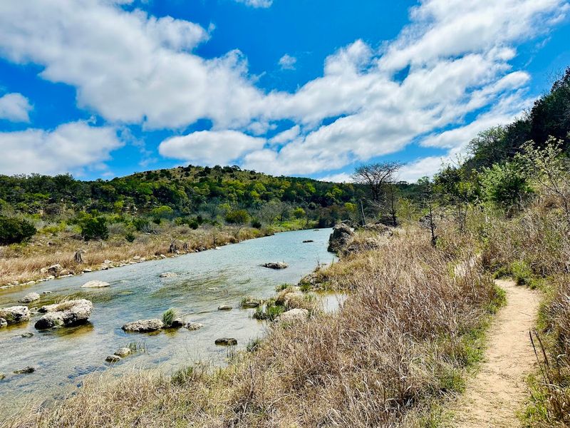 Horseback Riding Through Hill Country Terrain