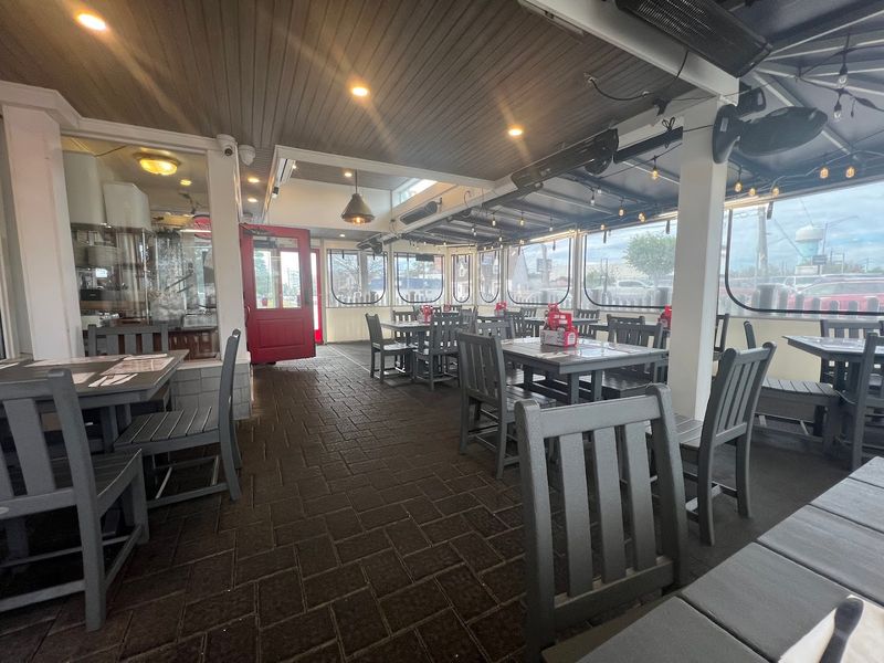 Outdoor seating, local chatter, and a cozy room