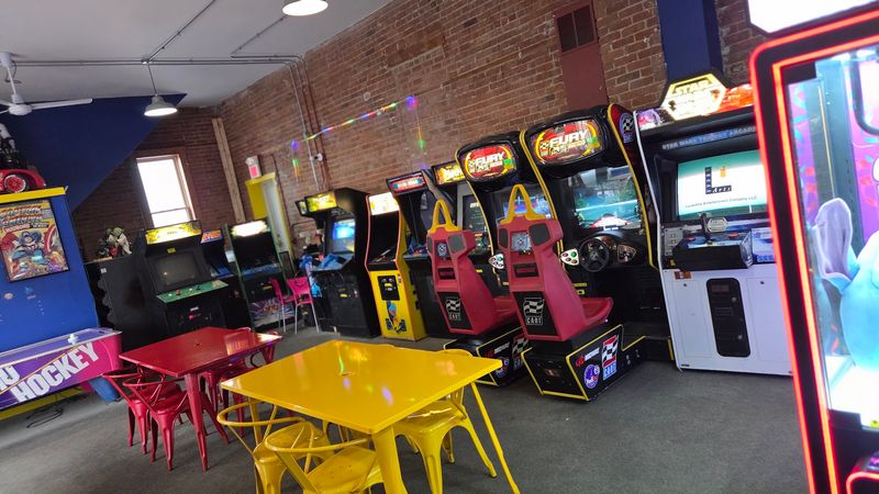 Retro Arcade and Toy-Covered Walls — The Atmosphere Is Half the Fun
