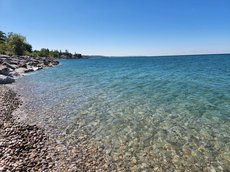 This Michigan Lakeside Town Is Known For Its Calm And Stress-Free Atmosphere 5 Hunting for Petoskey Stones on the Beach