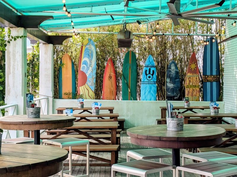 Surfer-Themed Atmosphere and Rooftop Seating