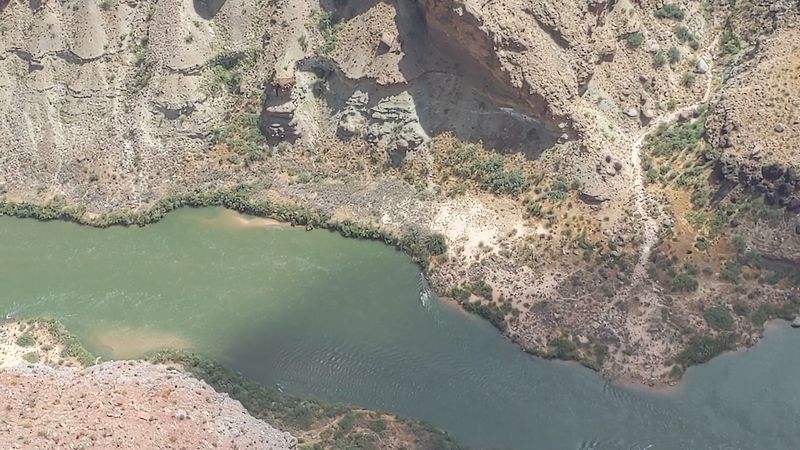Watching Rafters Navigate Lava Rapids Below
