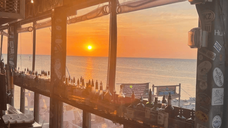 The Upstairs Bar and Sunset Toast Tradition