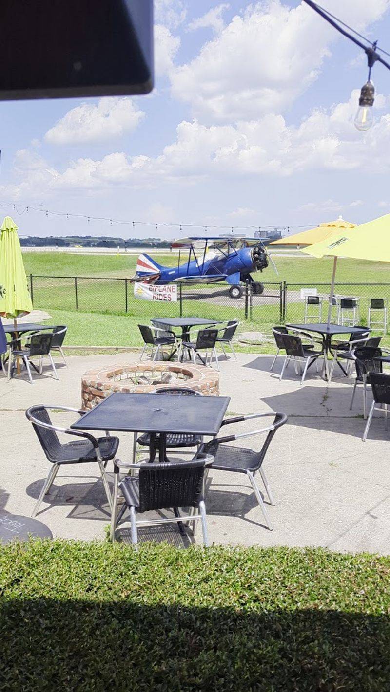 Outdoor Patio With Fireplaces and Plane Spotting