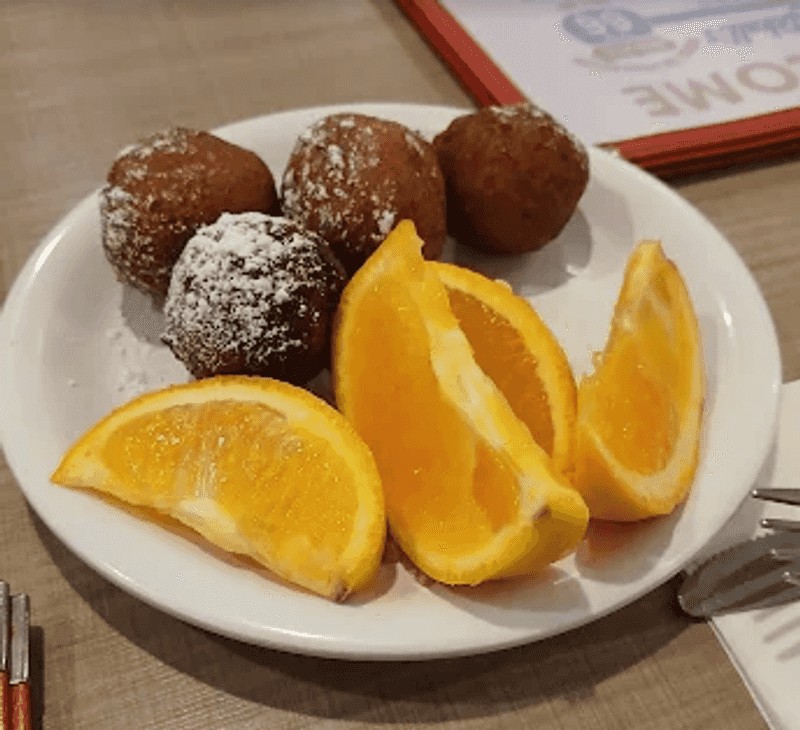 Complimentary Donut Holes and Orange Wedges to Start