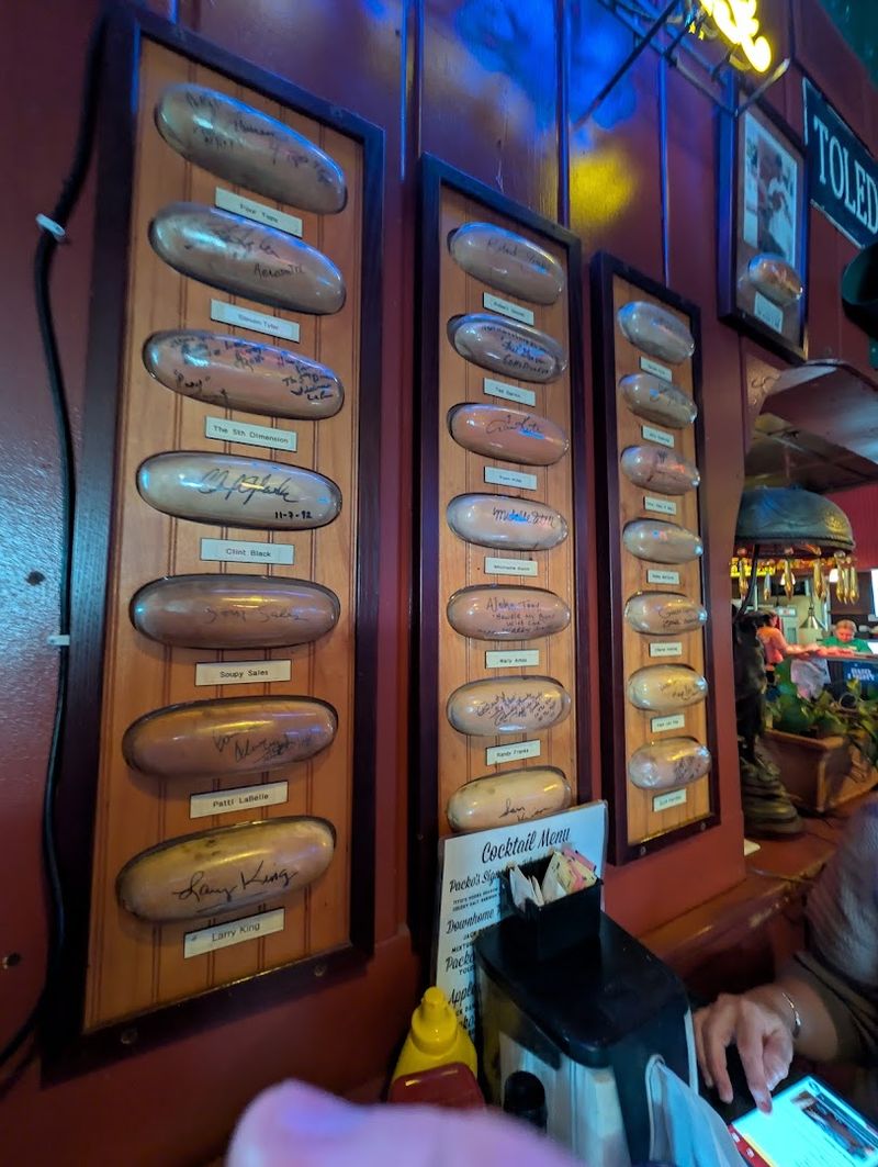 Famous Signed Hot Dog Buns Covering the Walls