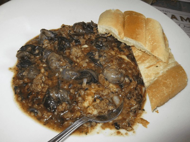 Garlic Snails Over Grits - A Must-Try Starter