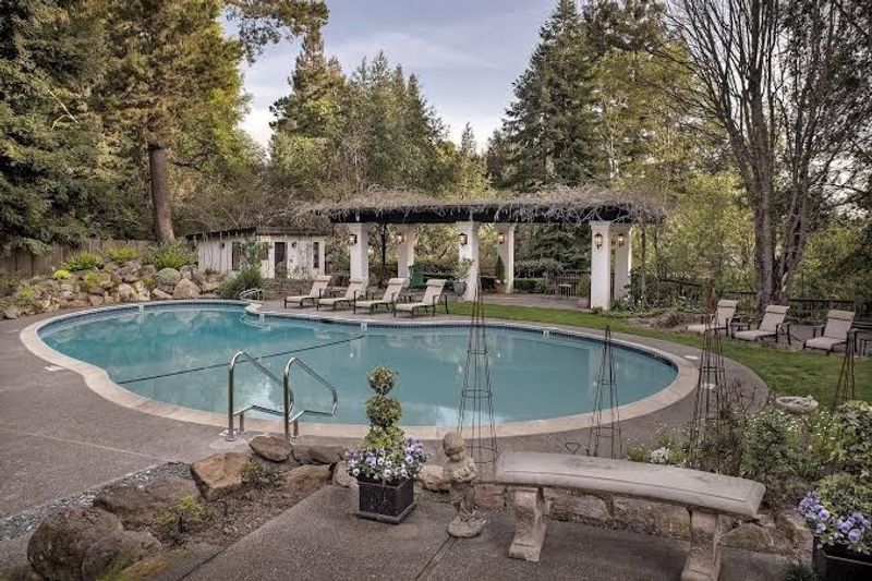 The Heated Outdoor Pool Surrounded by Redwood Trees The Heated Outdoor Pool Surrounded by Redwood Trees