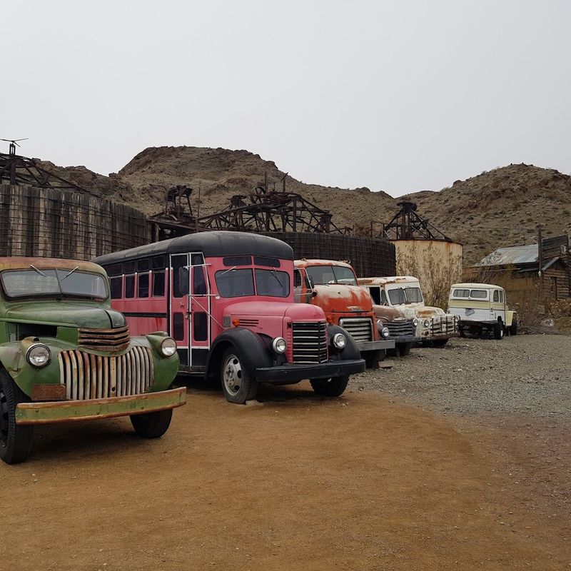 Vintage Cars and Rusted Trucks Scattered Across the Grounds
