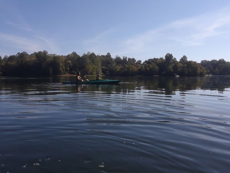 Paddleboarding on Calm Water With Open Sky Above