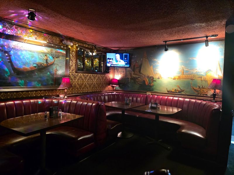 Red Leather Booths and Venetian Vibes Red Leather Booths and Venetian Vibes