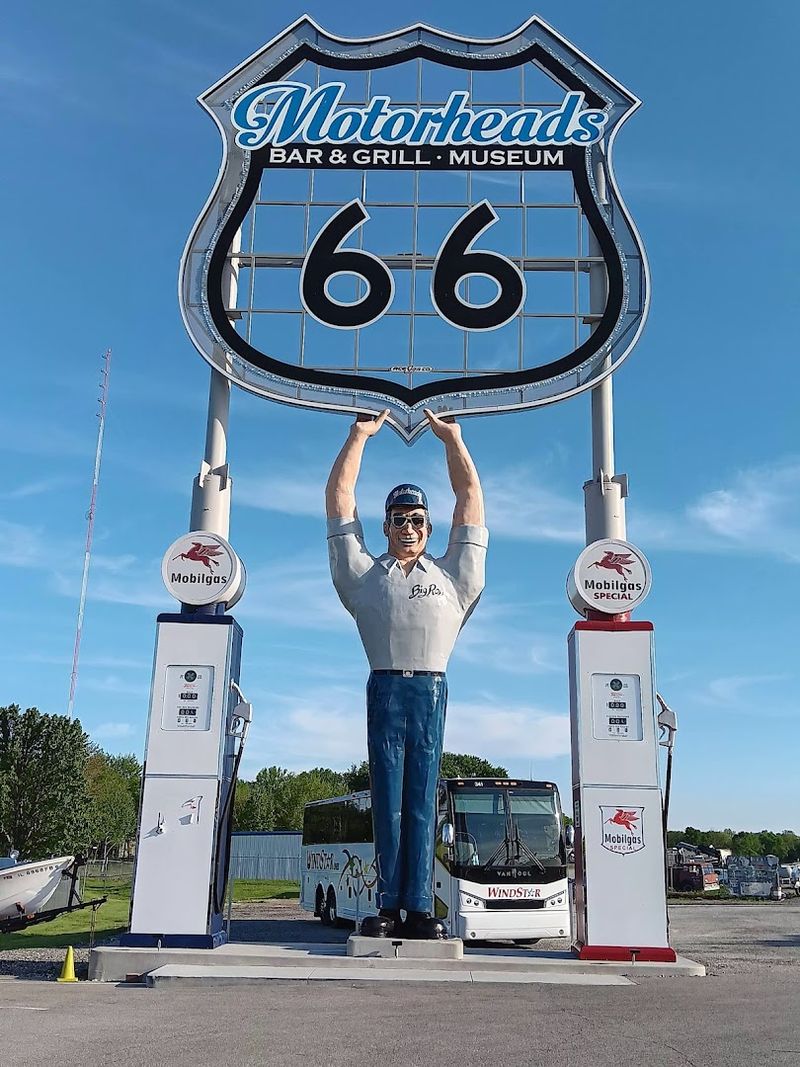The Iconic Route 66 Sign and Giant Roadside Figure Out Front The Iconic Route 66 Sign and Giant Roadside Figure Out Front