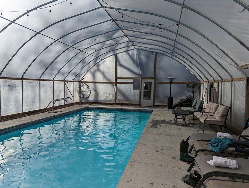 A Heated Pool, Hot Tub, and Sunroom for Ultimate Relaxation