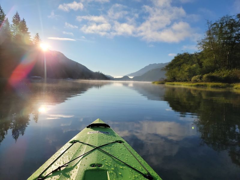 Kayaking Across Glass-Like Stillness Kayaking Across Glass-Like Stillness