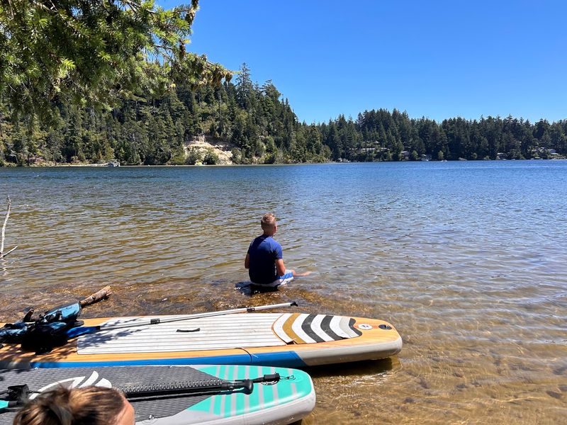 Kayaking and Paddleboarding on Calm Lake Waters Kayaking and Paddleboarding on Calm Lake Waters