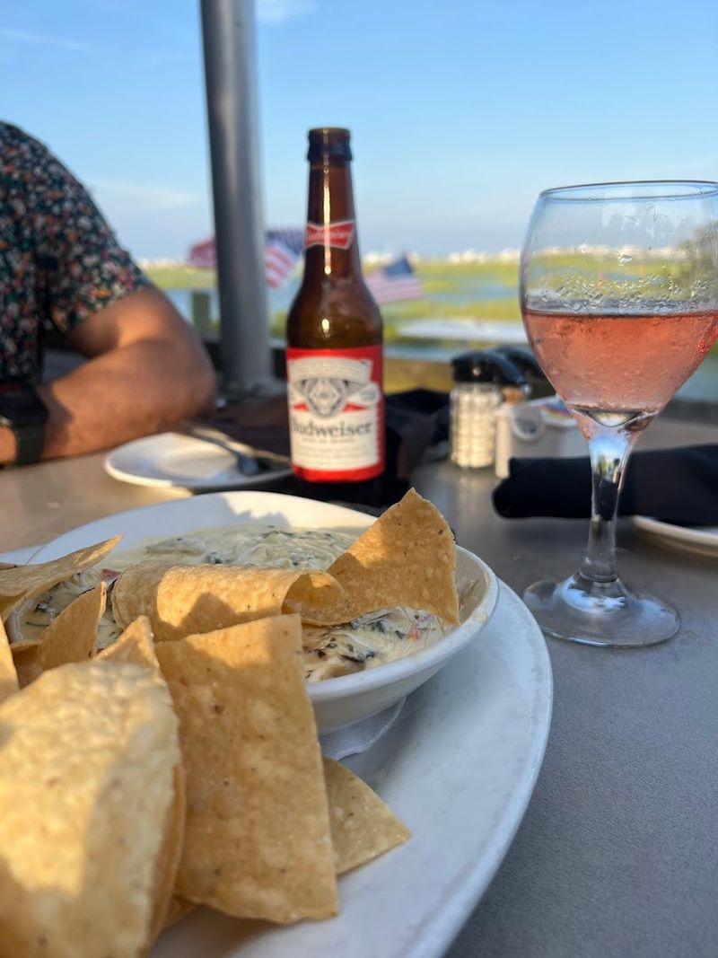 Outdoor Seating With a View of the Marsh Walk Boardwalk