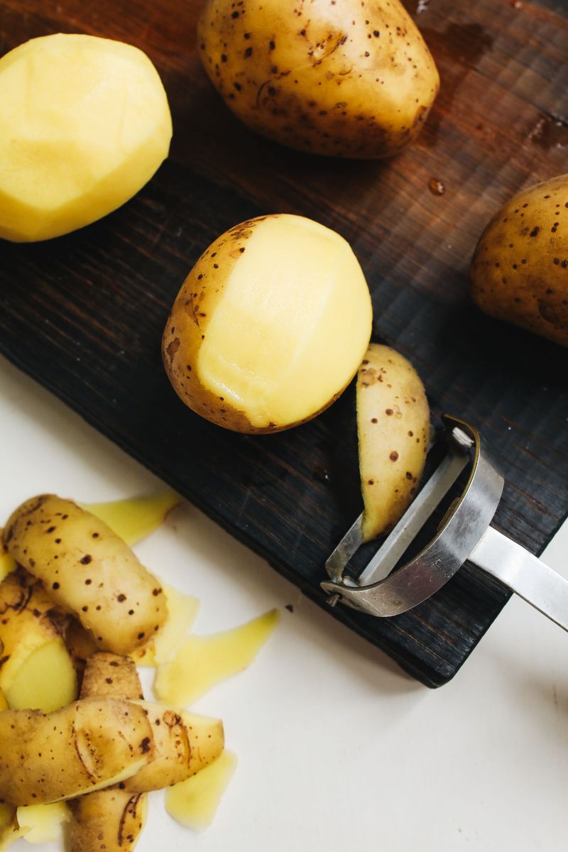 Peeling potatoes by hand Peeling potatoes by hand