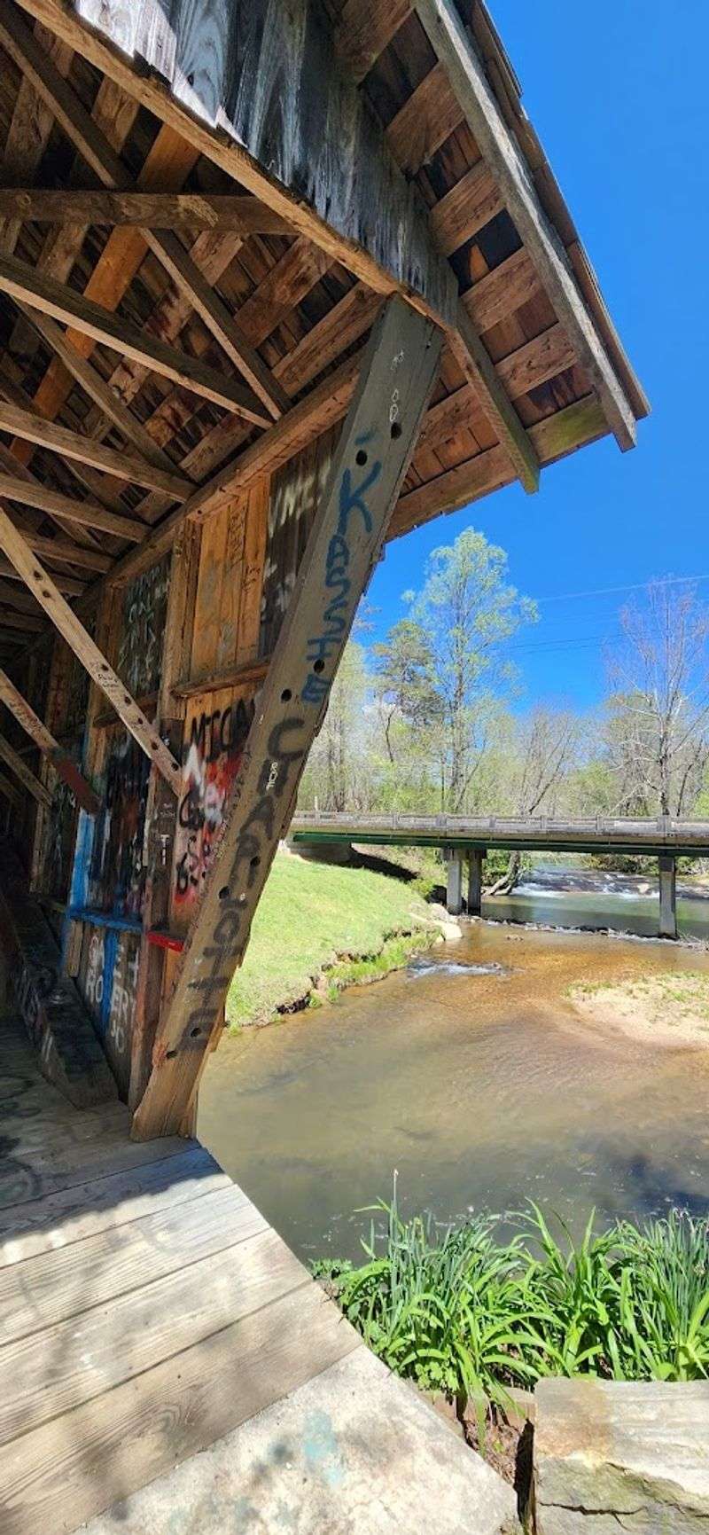 Picnic Tables by a Haunted Creek — A Strange Kind of Peace