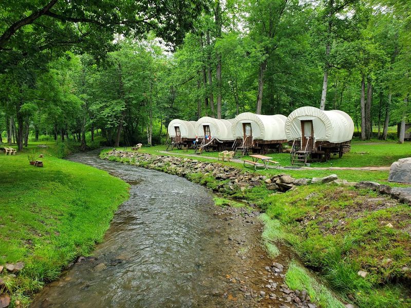 The Iconic Covered Wagon Rooms Along the Stream