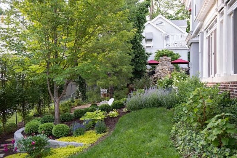 A Courtyard Garden With a Fountain and Fish Pond