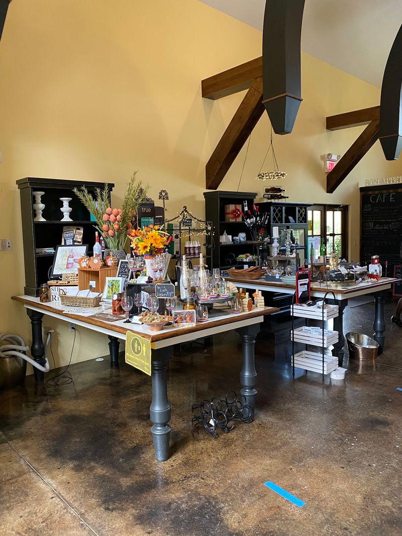 A Little Shop with Bottles and Merchandise to Take Home
