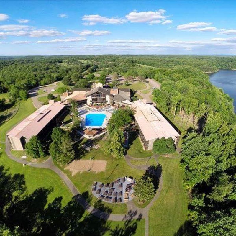 A Lodge With Timber Beams And Two Pools