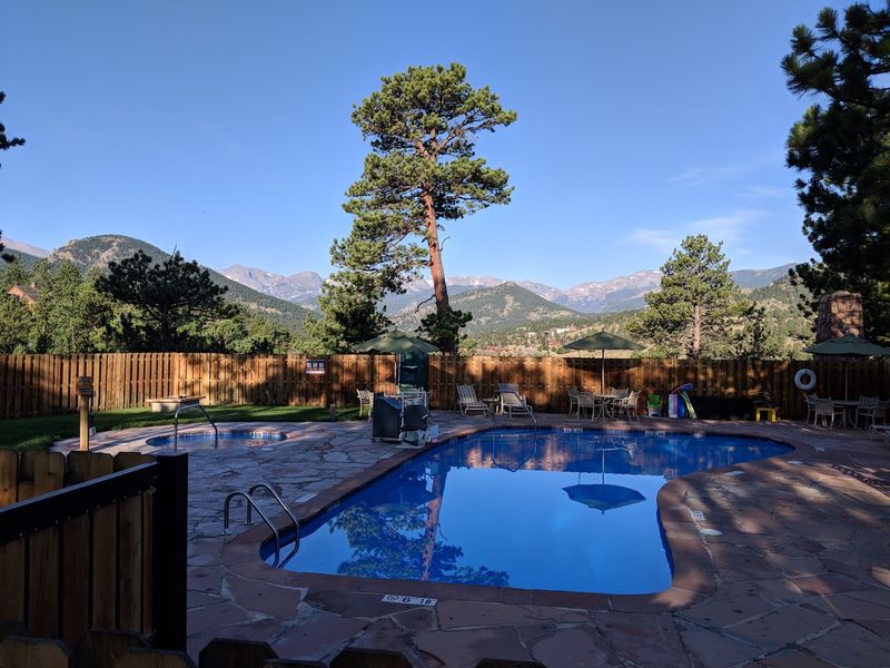 A Pool And Hot Tub With Mountain Views