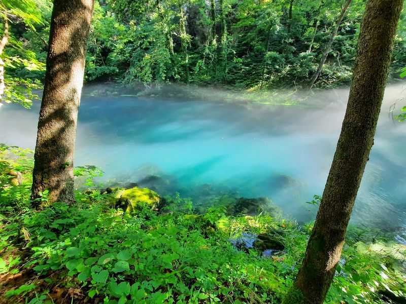 A Spring That Glows an Unreal Blue