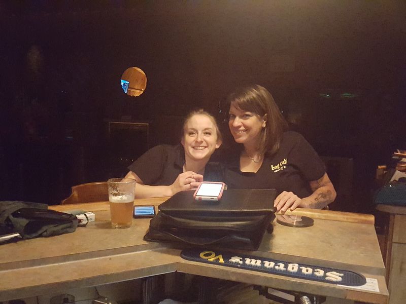Friendly Faces Behind the Bar and Tables